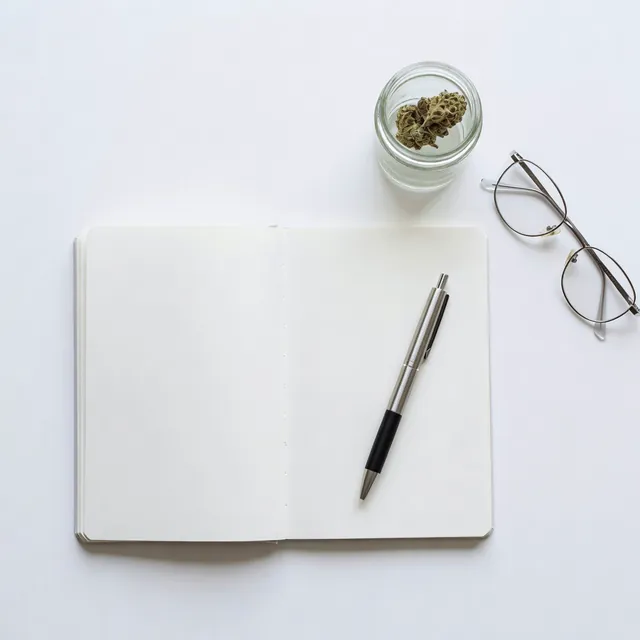 Cannabis education notebook and products at Cannadreams, a licensed Hell's Kitchen dispensary in Manhattan