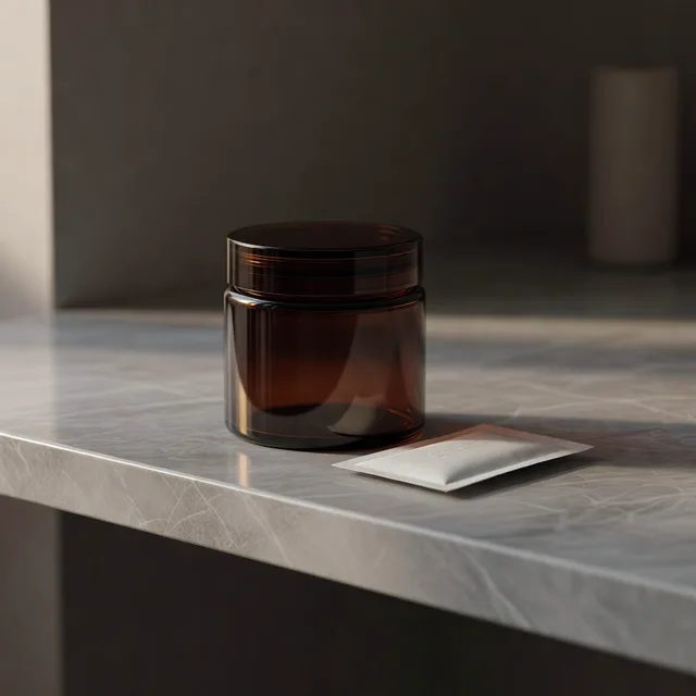 A sealed amber glass cannabis jar with a humidity pack on a cool marble shelf
